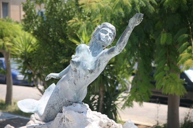 Poros Island - Mermaid fountain statue near the ferry-boat landing 